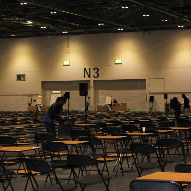 https://d1hcs5uofxldvl.cloudfront.net/furniture-hire-uk/article_additional/ucas-job4/ucas-job4.jpg - Team hard at work taking down exam tables.