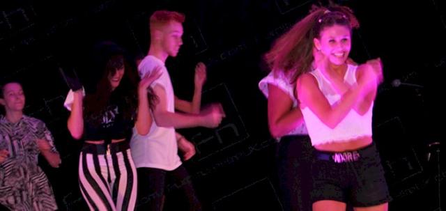 Wear It For Autism https://d1hcs5uofxldvl.cloudfront.net/furniture-hire-uk/article_additional/anna-kennedy-online8/anna-kennedy-online8-740x350.jpg - Dancers perform on stage.