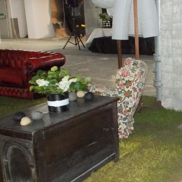 Art Launch with a Difference https://d1hcs5uofxldvl.cloudfront.net/furniture-hire-uk/article_additional/art-launch5/art-launch5.jpg - Real grass & wooden furnishings form part of the set.