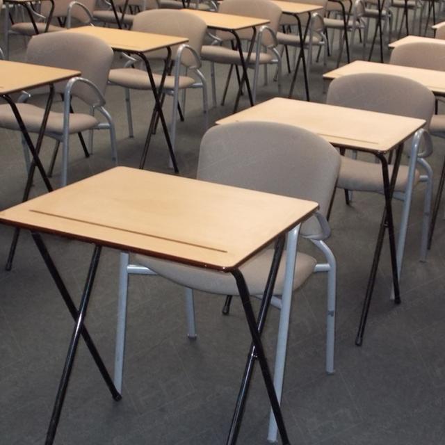 Assessments In The City https://d1hcs5uofxldvl.cloudfront.net/furniture-hire-uk/article_additional/assessments-in-the-city/assessments-in-the-city.jpg - Slightly tilted exam desk surface for comfort.