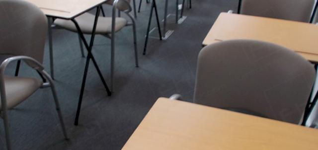 Assessments In The City https://d1hcs5uofxldvl.cloudfront.net/furniture-hire-uk/article_additional/assessments-in-the-city4/assessments-in-the-city4-740x350.jpg - Folding exam desks set up in London venue.