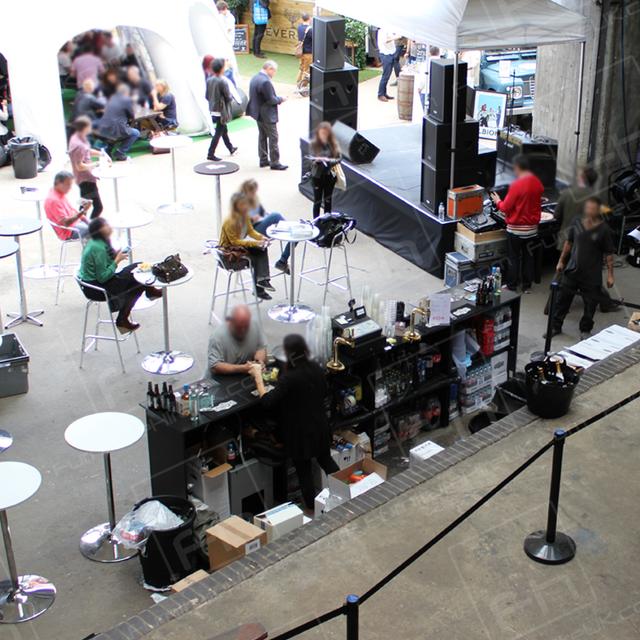 British Fashion https://d1hcs5uofxldvl.cloudfront.net/furniture-hire-uk/article_additional/best-of-british-fashion5/best-of-british-fashion5.jpg - Black barriers define dining areas at fashion event.