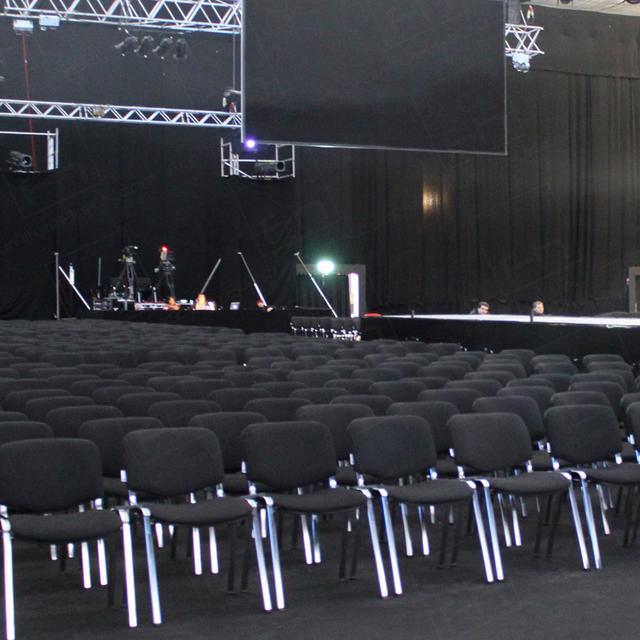 Catwalk Shows https://d1hcs5uofxldvl.cloudfront.net/furniture-hire-uk/article_additional/chair-hire-and-catwalk-shows6/chair-hire-and-catwalk-shows6.jpg - Black conference chairs make a subtle filming backdrop.