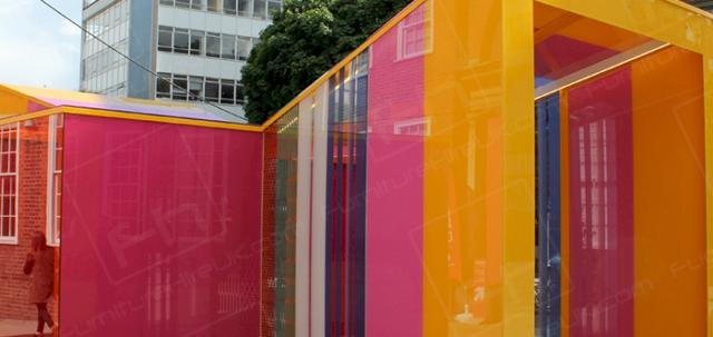 Clerkenwell Design Week https://d1hcs5uofxldvl.cloudfront.net/furniture-hire-uk/article_additional/clerkenwell-design-week2/clerkenwell-design-week2-740x350.jpg - Ultra modern glass house featuring different coloured panes of glass.