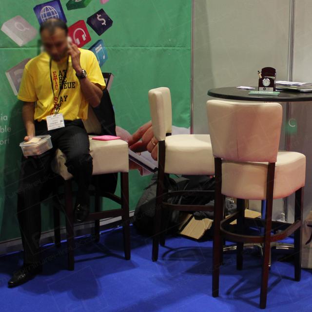 Walnut Furniture for Ultra-Classy Exhibitions https://d1hcs5uofxldvl.cloudfront.net/furniture-hire-uk/article_additional/executive-furniture-hire-at-exhibitions2/executive-furniture-hire-at-exhibitions2.jpg - Padded stools bring comfort & style to exhibition spaces.