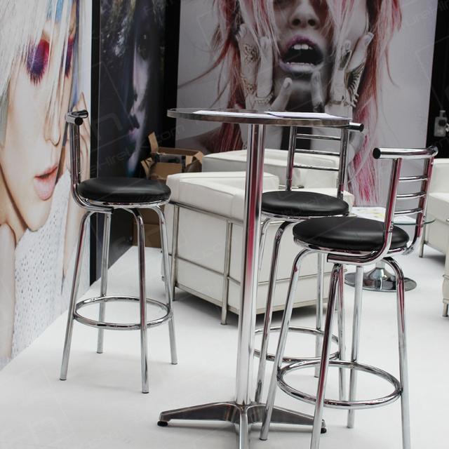 Hairdressing Exhibition https://d1hcs5uofxldvl.cloudfront.net/furniture-hire-uk/article_additional/hairdressing-exhibition3/hairdressing-exhibition3.jpg - Chrome tables & stools team well with white sofas.