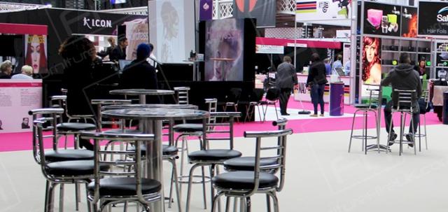 Hairdressing Exhibition https://d1hcs5uofxldvl.cloudfront.net/furniture-hire-uk/article_additional/hairdressing-exhibition6/hairdressing-exhibition6-740x350.jpg - Poseur tables & stools set up in ProHairLive restaurant zone.