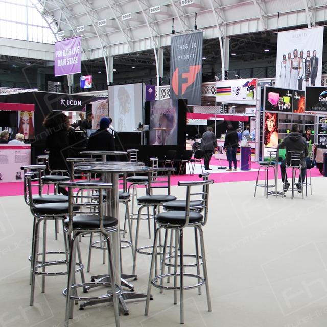 Hairdressing Exhibition https://d1hcs5uofxldvl.cloudfront.net/furniture-hire-uk/article_additional/hairdressing-exhibition6/hairdressing-exhibition6.jpg - Poseur tables & stools set up in ProHairLive restaurant zone.