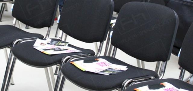 Hairdressing Exhibition https://d1hcs5uofxldvl.cloudfront.net/furniture-hire-uk/article_additional/hairdressing-exhibition9/hairdressing-exhibition9-740x350.jpg - Black conference chairs installed for ProHairLive seminars.