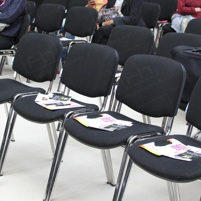 Hairdressing Exhibition https://d1hcs5uofxldvl.cloudfront.net/furniture-hire-uk/article_additional/hairdressing-exhibition9/hairdressing-exhibition9.jpg - Black conference chairs installed for ProHairLive seminars.