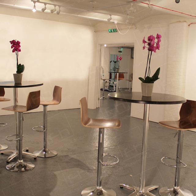 London Art Event https://d1hcs5uofxldvl.cloudfront.net/furniture-hire-uk/article_additional/london-art-event2/london-art-event2.jpg - Stools & tables set up for gallery show.