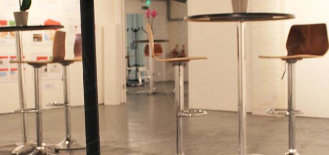 London Art Event https://d1hcs5uofxldvl.cloudfront.net/furniture-hire-uk/article_additional/london-art-event4/london-art-event4-740x350.jpg - Stools & tables complement minimalist gallery decor.