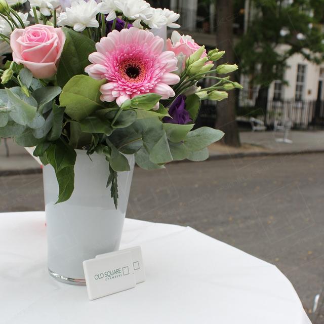 Street Party https://d1hcs5uofxldvl.cloudfront.net/furniture-hire-uk/article_additional/street-party2/street-party2.jpg - Poseur tables accessorised with flowers.
