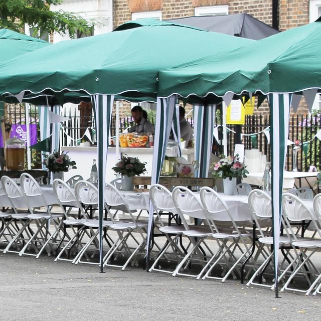 Street Party https://d1hcs5uofxldvl.cloudfront.net/furniture-hire-uk/article_additional/street-party6/street-party6.jpg - Folding fan backs set up for street picnic.