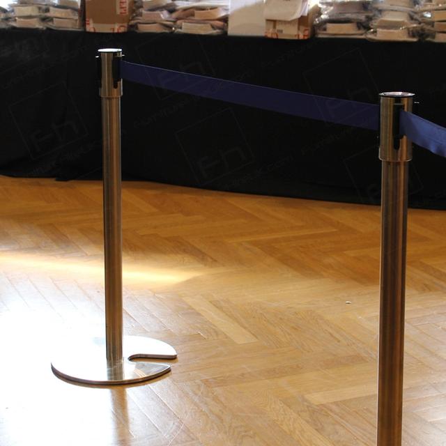 Crowd Control at Fashion Events https://d1hcs5uofxldvl.cloudfront.net/furniture-hire-uk/article_additional/stretch-barriers-and-luxury-goods7/stretch-barriers-and-luxury-goods7.jpg - Chrome posts & blue wedding for smart crowd control.