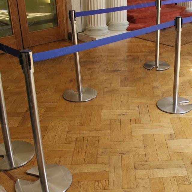 Crowd Control at Fashion Events https://d1hcs5uofxldvl.cloudfront.net/furniture-hire-uk/article_additional/stretch-barriers-and-luxury-goods9/stretch-barriers-and-luxury-goods9.jpg - Chrome stretch barriers in a parallel configuration.