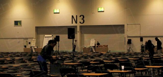 ExCeL Job https://d1hcs5uofxldvl.cloudfront.net/furniture-hire-uk/article_additional/ucas-job4/ucas-job4-740x350.jpg - Team hard at work taking down exam tables.