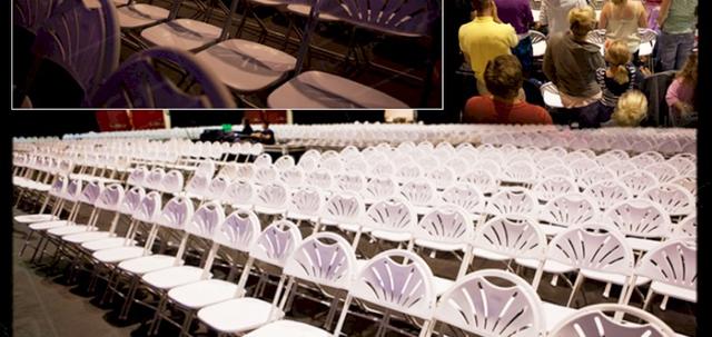 Westpoint 2013 https://d1hcs5uofxldvl.cloudfront.net/furniture-hire-uk/article_additional/westpoint14/westpoint14-740x350.jpg - White folding chairs lined up for religious meeting & talks.
