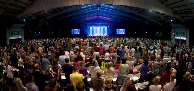 Westpoint 2013 https://d1hcs5uofxldvl.cloudfront.net/furniture-hire-uk/article_additional/westpoint17/westpoint17-740x350.jpg - Large crowd gathered for religious occasion using our seating.