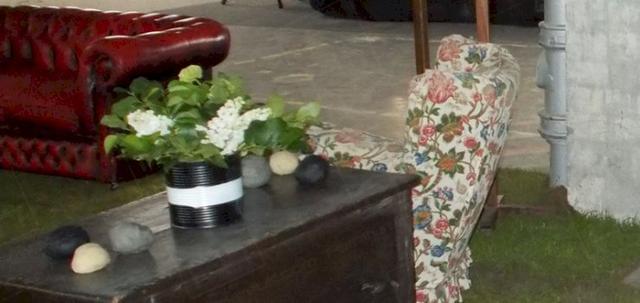 Art Launch with a Difference https://mill-media.s3.eu-west-2.amazonaws.com/furniture-hire-uk/article_additional/art-launch5/art-launch5-740x350.jpg - Real grass & wooden furnishings form part of the set.