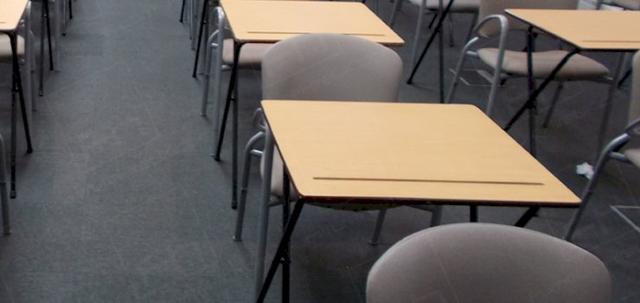 Assessments In The City https://mill-media.s3.eu-west-2.amazonaws.com/furniture-hire-uk/article_additional/assessments-in-the-city5/assessments-in-the-city5-740x350.jpg - Long lines of exam tables making the most of available space.