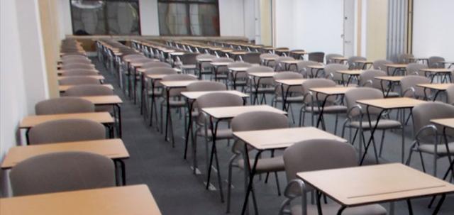 Assessments In The City https://mill-media.s3.eu-west-2.amazonaws.com/furniture-hire-uk/article_additional/assessments-in-the-city6/assessments-in-the-city6-740x350.jpg - Light oak exam desks look smart in corporate locations.