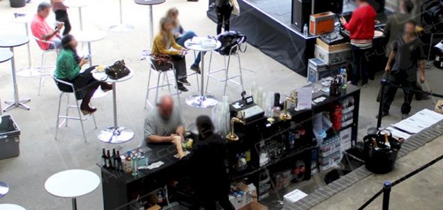 British Fashion https://mill-media.s3.eu-west-2.amazonaws.com/furniture-hire-uk/article_additional/best-of-british-fashion5/best-of-british-fashion5-740x350.jpg - Black barriers define dining areas at fashion event.