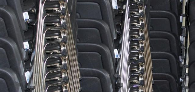 Chapel Job 2013 https://mill-media.s3.eu-west-2.amazonaws.com/furniture-hire-uk/article_additional/chapel3/chapel3-740x350.jpg - Stacks of our black conference chairs ready for installation.
