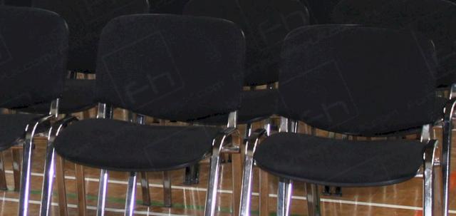 Chapel Job 2013 https://mill-media.s3.eu-west-2.amazonaws.com/furniture-hire-uk/article_additional/chapel7/chapel7-740x350.jpg - Black conference chairs laid out for chapel event.