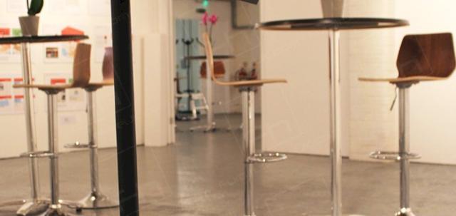 London Art Event https://mill-media.s3.eu-west-2.amazonaws.com/furniture-hire-uk/article_additional/london-art-event4/london-art-event4-740x350.jpg - Stools & tables complement minimalist gallery decor.