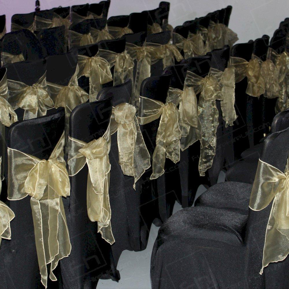 Banquet chairs with black covers and gold bows | HC108