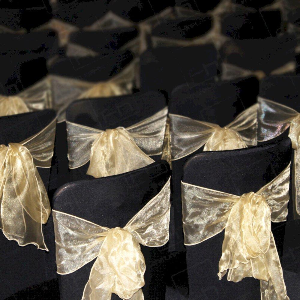 Smart black chair covers & gold bows for charity evening.