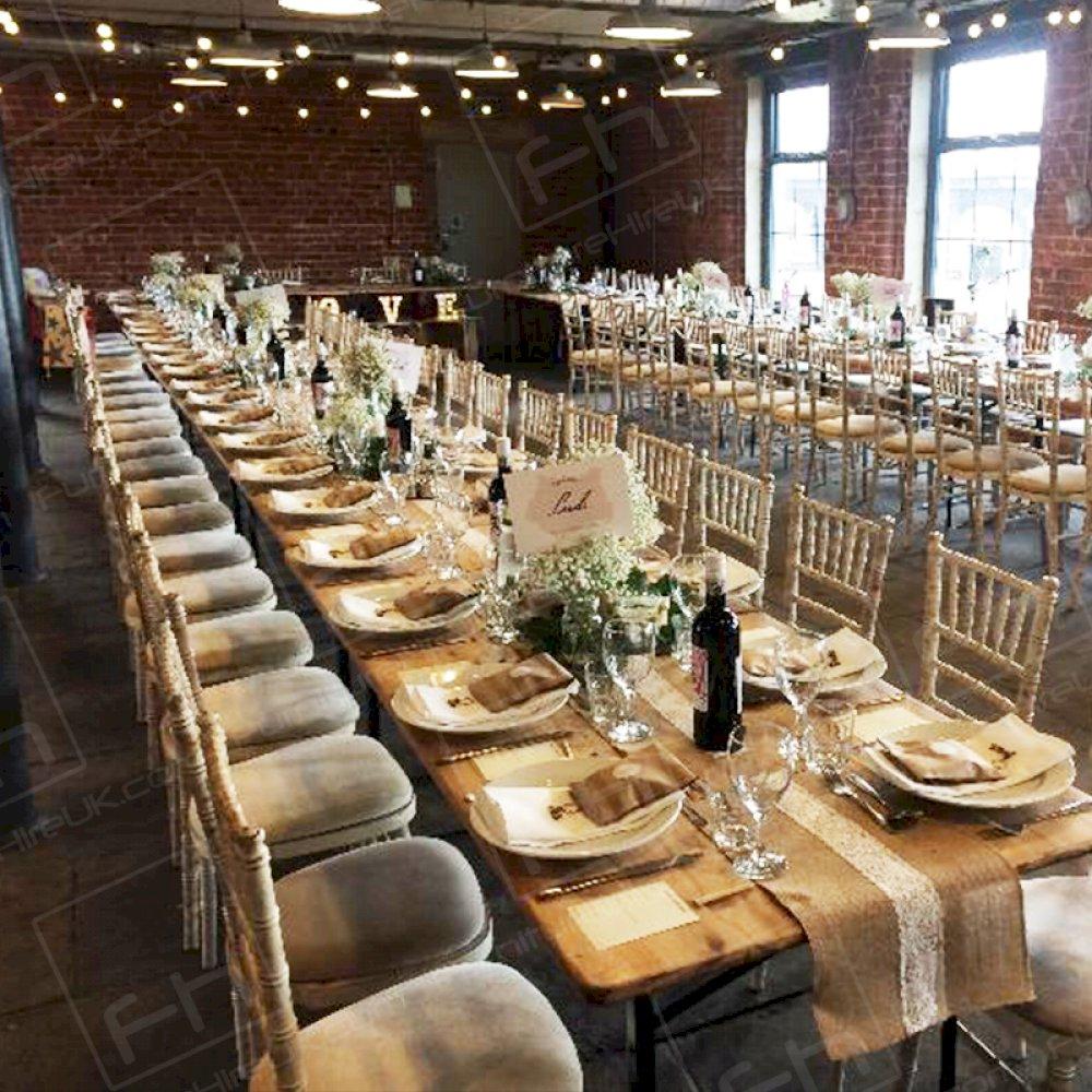 Our Limewash Chiavari Chairs with cream pads at a stunning event.