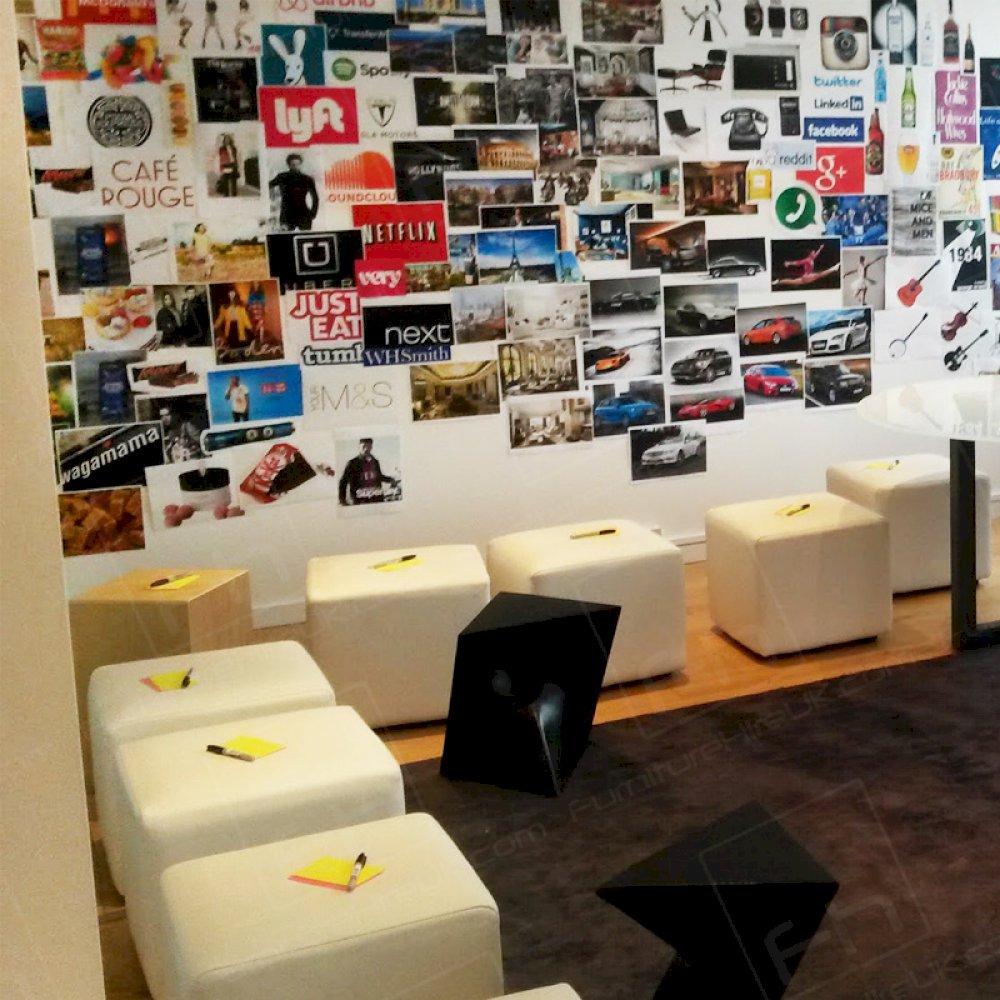 Transforming a board room into a creative space with the use of white cubes.