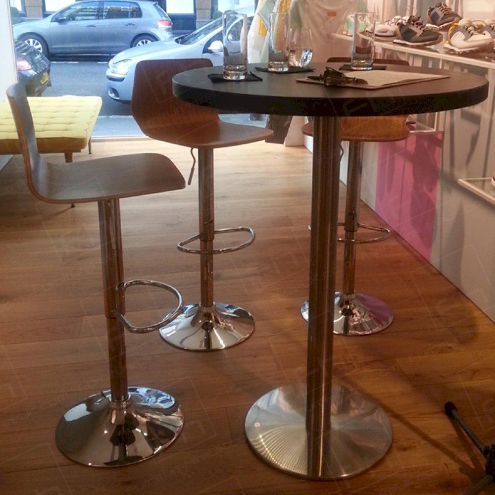 Walnut poseur tables & stools add to the stylish venue.