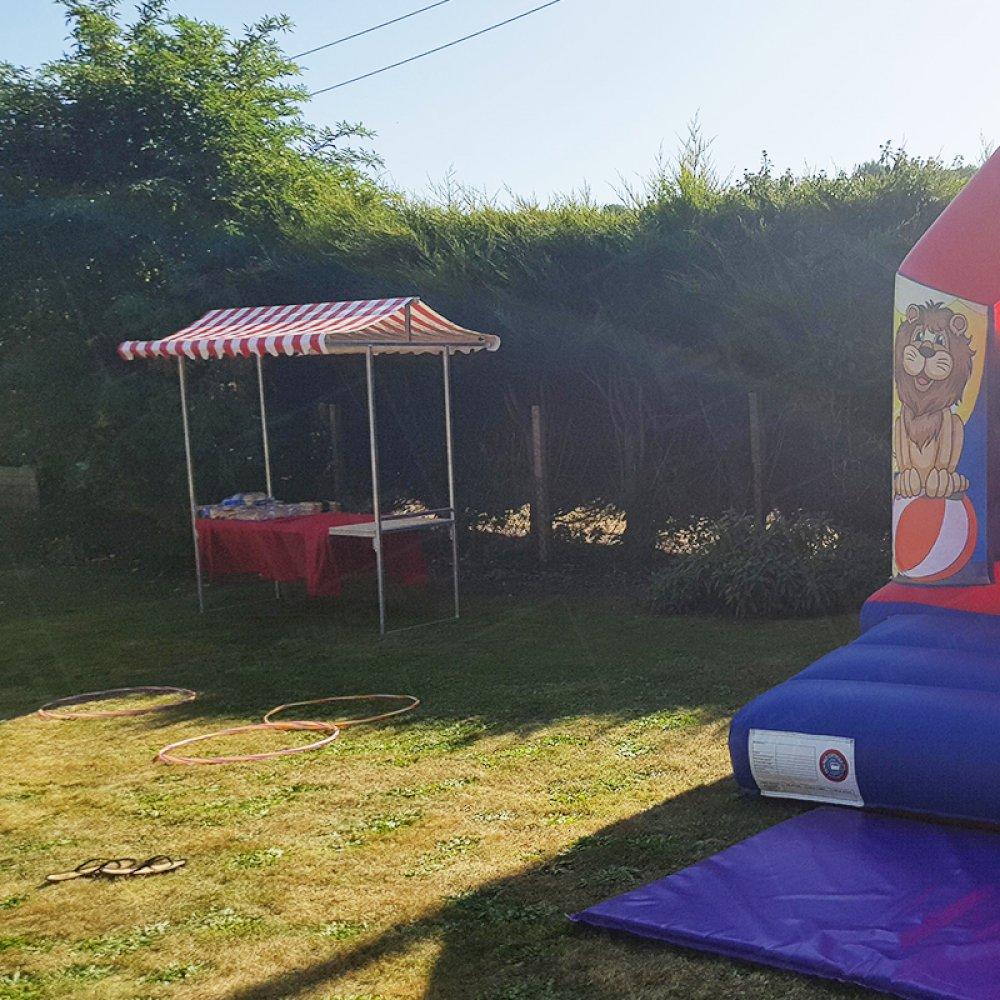 Our red folding market stand has a 2m wooden tabletop and is weatherproof which makes it ideal for outdoor events.