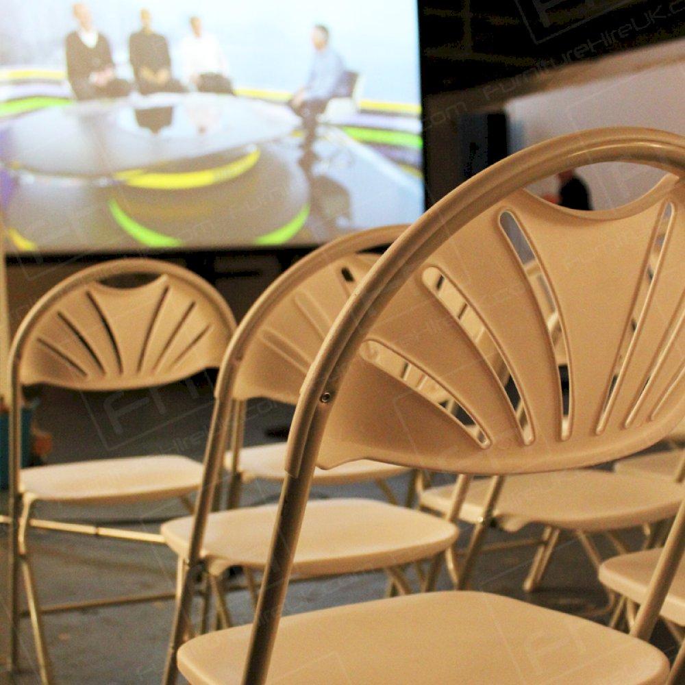 Big screen TV and comfortable chairs for impromptu events within the workplace.
