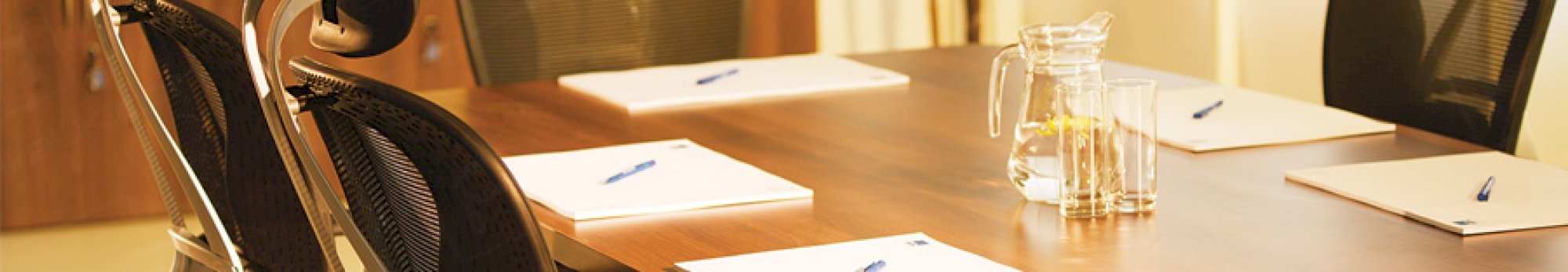 walnut boardroom with ergonomic chairs