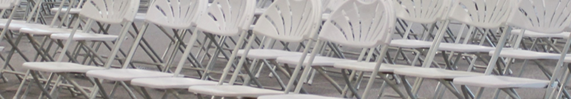 white folding chairs set up