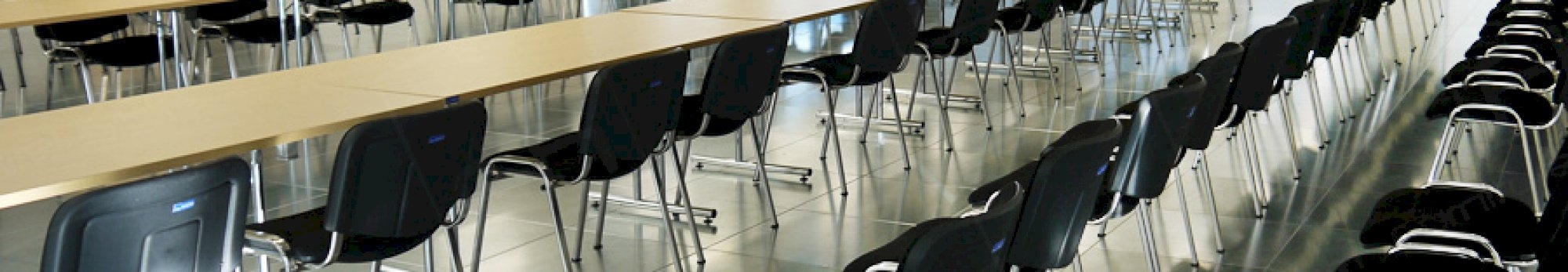 meeting tables, stacking chairs and freestanding screens